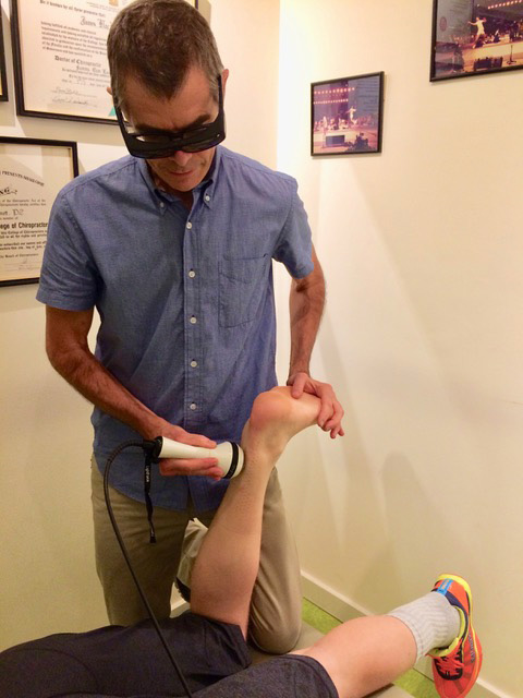 Dr Grimmett applying Laser Therapy 